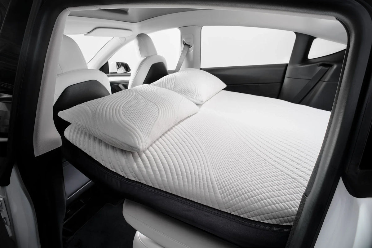 Snuuzu mattress with two pillows installed inside a Tesla Model Y