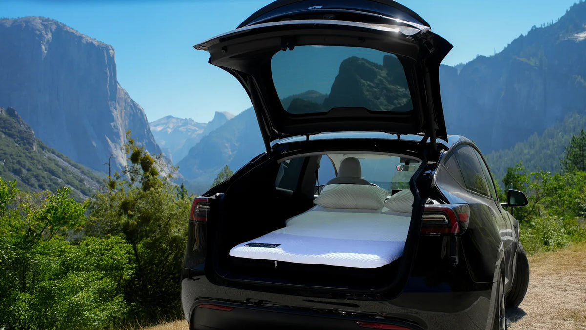 Snuuzu mattress in an open Tesla Model Y overlooking Yosemite Valley