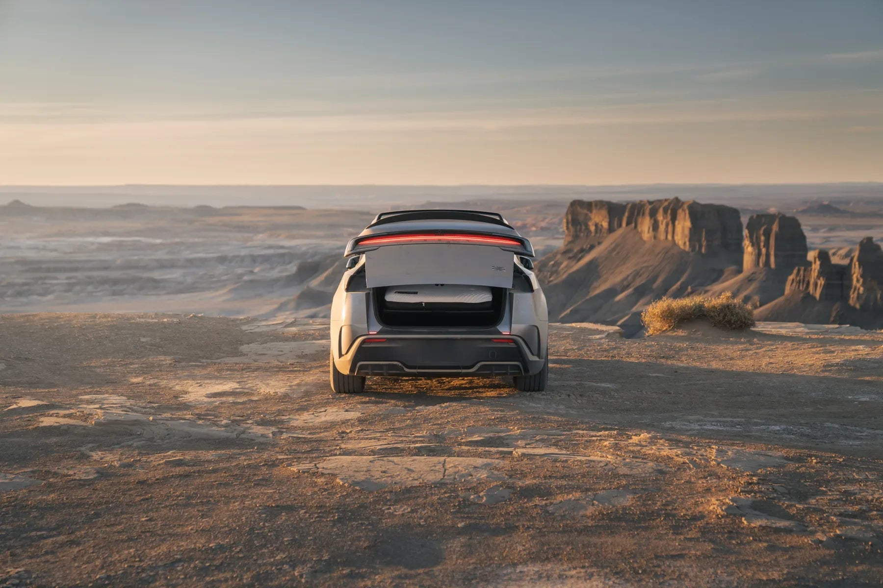 Snuuzu mattress visible through the open hatch of a refreshed Tesla Model Y