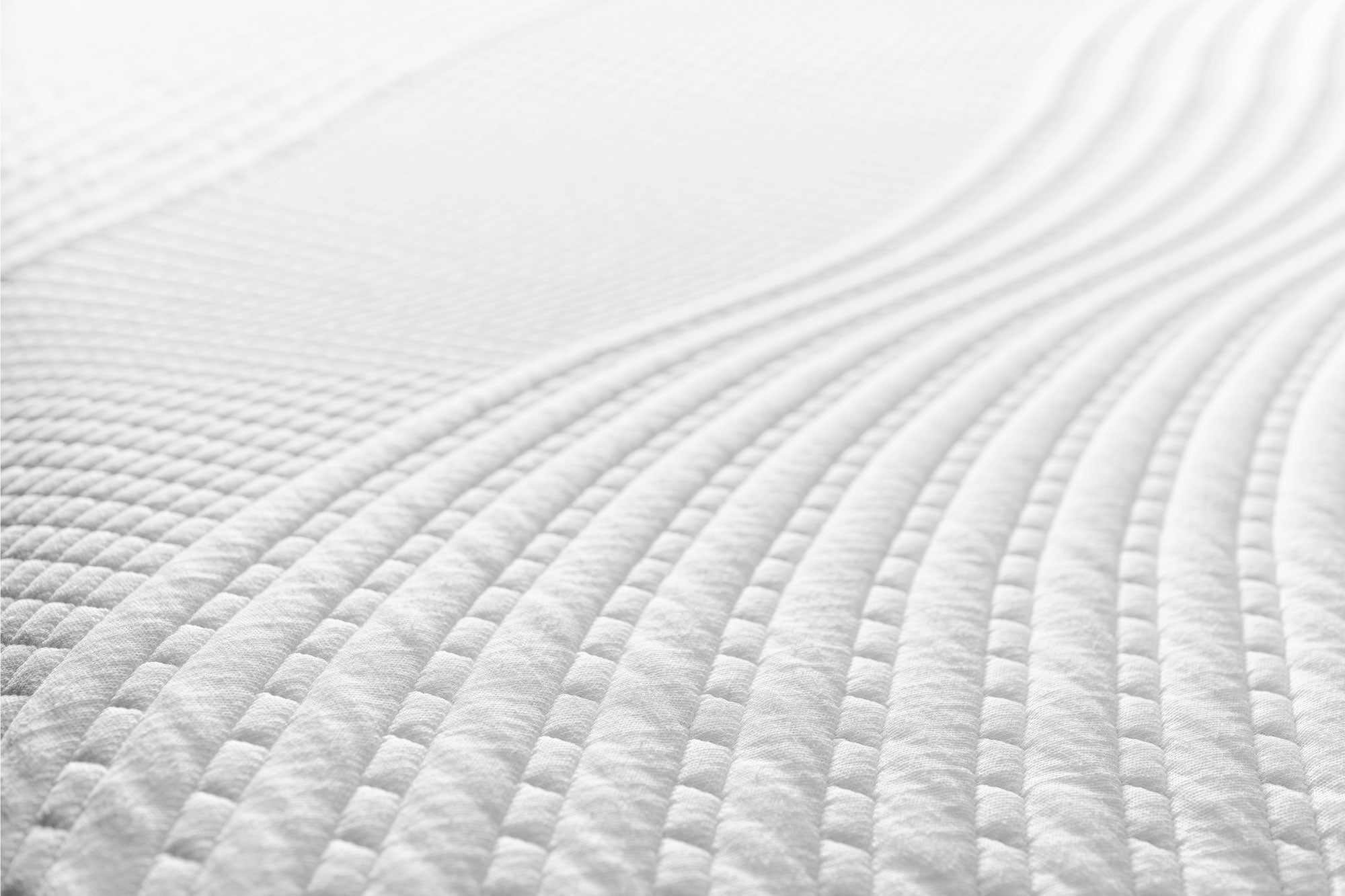 Close-up of the Snuuzu Tesla camping mattress Tencel fabric showing the quilted breathable comfort surface